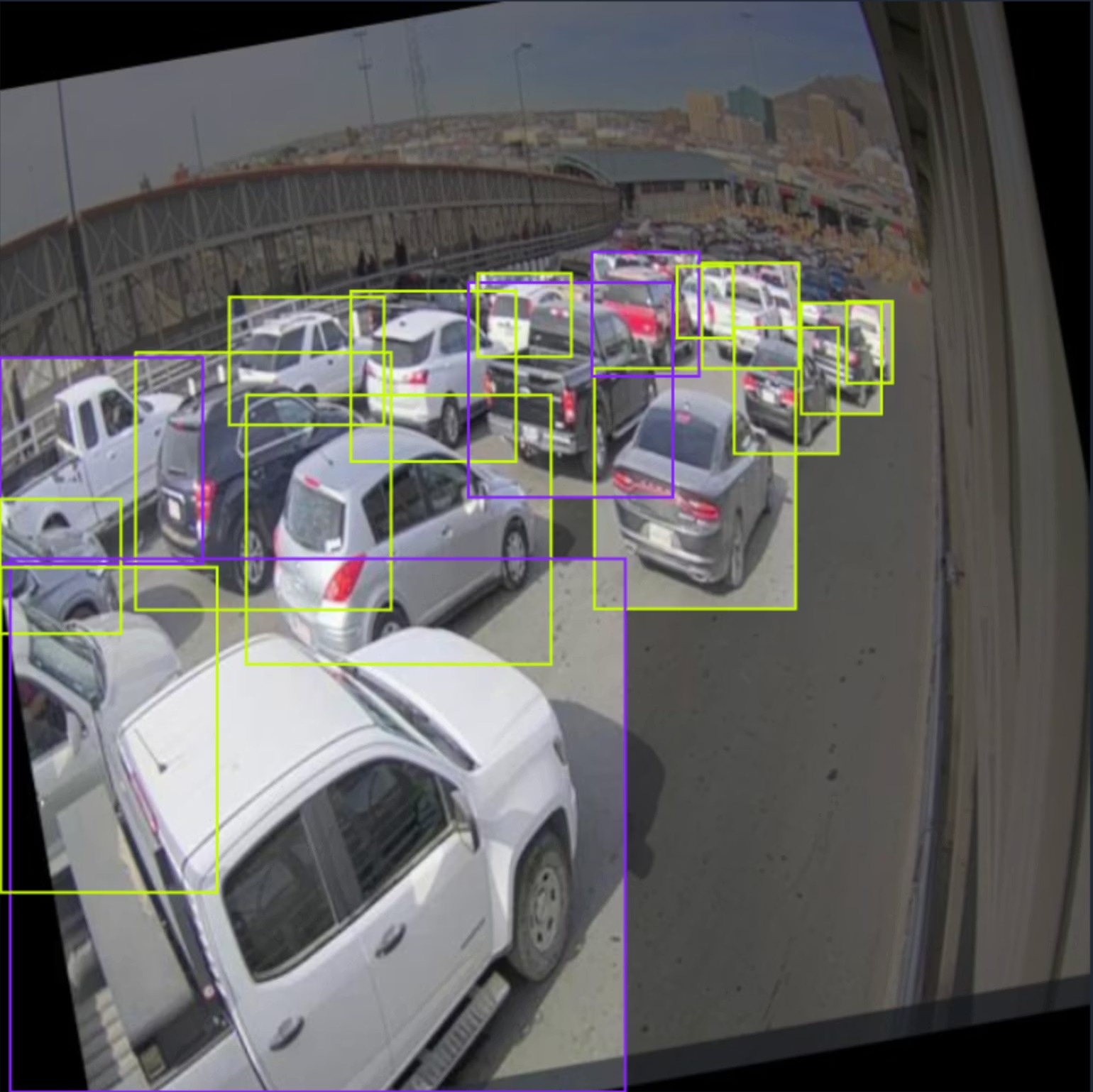 BorderFlow prototype identifying vehicles in border traffic footage with object-detection boxes